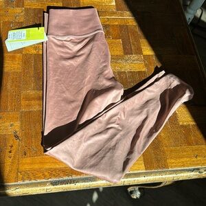 Girls size Medium all in motion Leggings. Pink shimmery. Never been worn